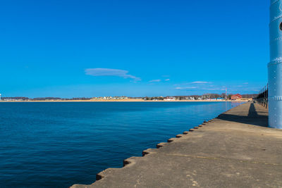 Scenic view of sea against blue sky