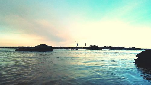 Men fishing at sea