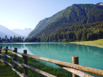 Scenic view of lake and mountains against sky