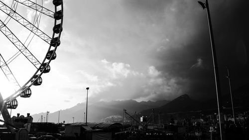 Low angle view of amusement park against sky