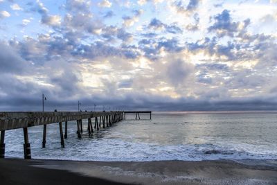 Scenic view of sea against cloudy sky