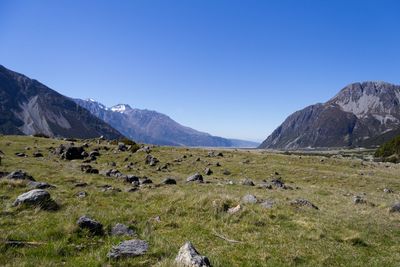 Scenic view of mountains against clear blue sky