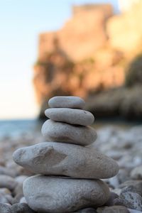 Close-up of stack of pebbles on beach