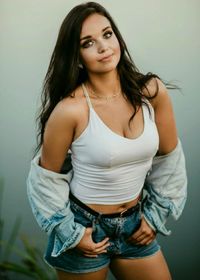 Portrait of beautiful young woman wearing tank top