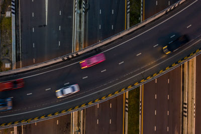 Aerial view traffic car transportation freeway motorway and ring road at twilight moving car 