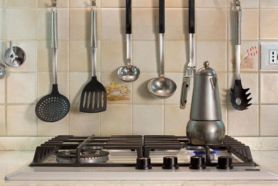 Electric lamps hanging in kitchen at home