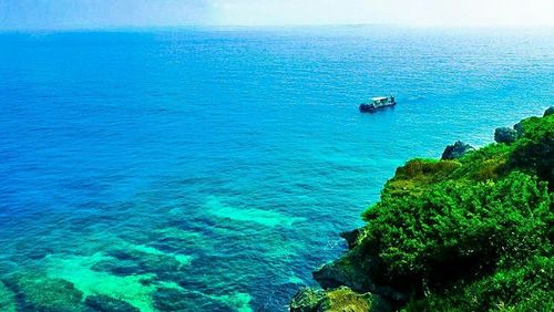 Scenic view of seascape against blue sky