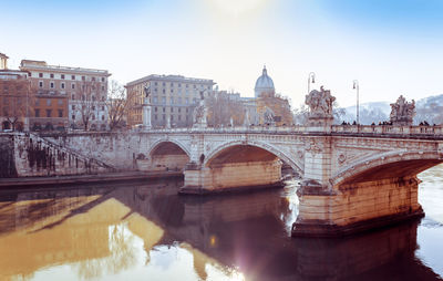 Ponte sant angelo over tiber river by st peter basilica