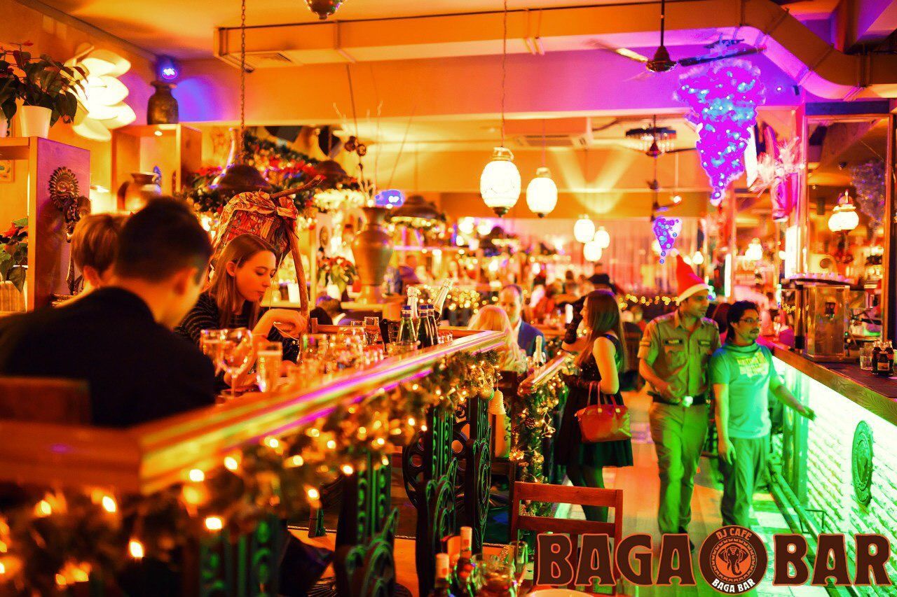 illuminated, indoors, night, market stall, retail, celebration, lifestyles, men, large group of people, person, lighting equipment, market, leisure activity, choice, store, for sale, variation, decoration, restaurant