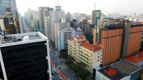 High angle view of buildings in city against sky