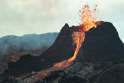 Scenic view of volcanic mountain against sky