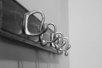 Close-up of hooks on wall