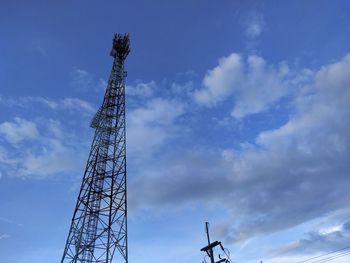 Low angle view of crane against sky