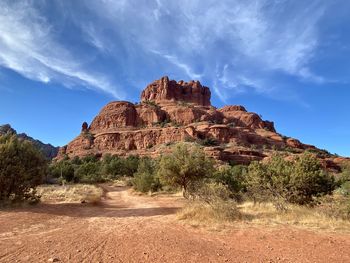 View of rock formations on landscape against sky