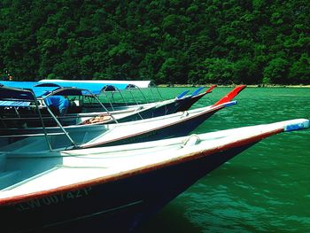 Boats moored on sea