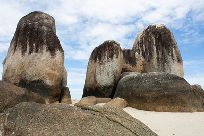 Low angle view of rock formation against sky