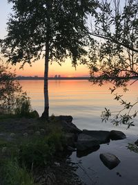 Scenic view of lake against sky during sunset