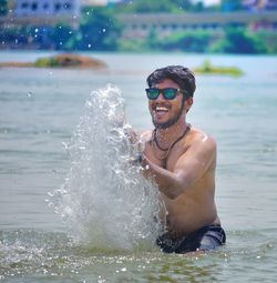 Happy man enjoying in river