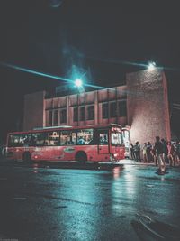 View of cars on road at night