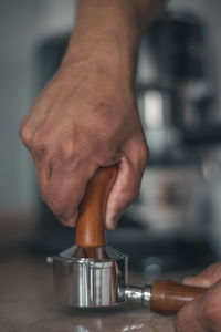 Close-up of man holding coffee cup