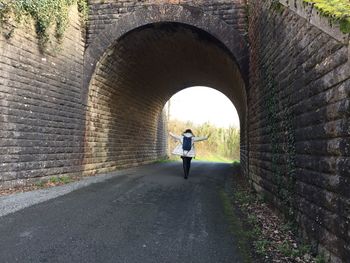 People walking in tunnel