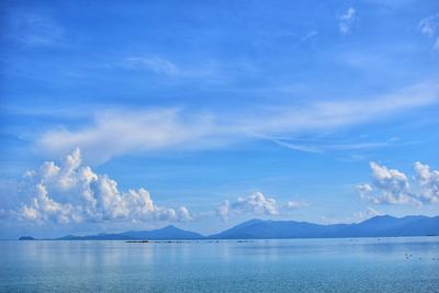 Scenic view of sea against blue sky