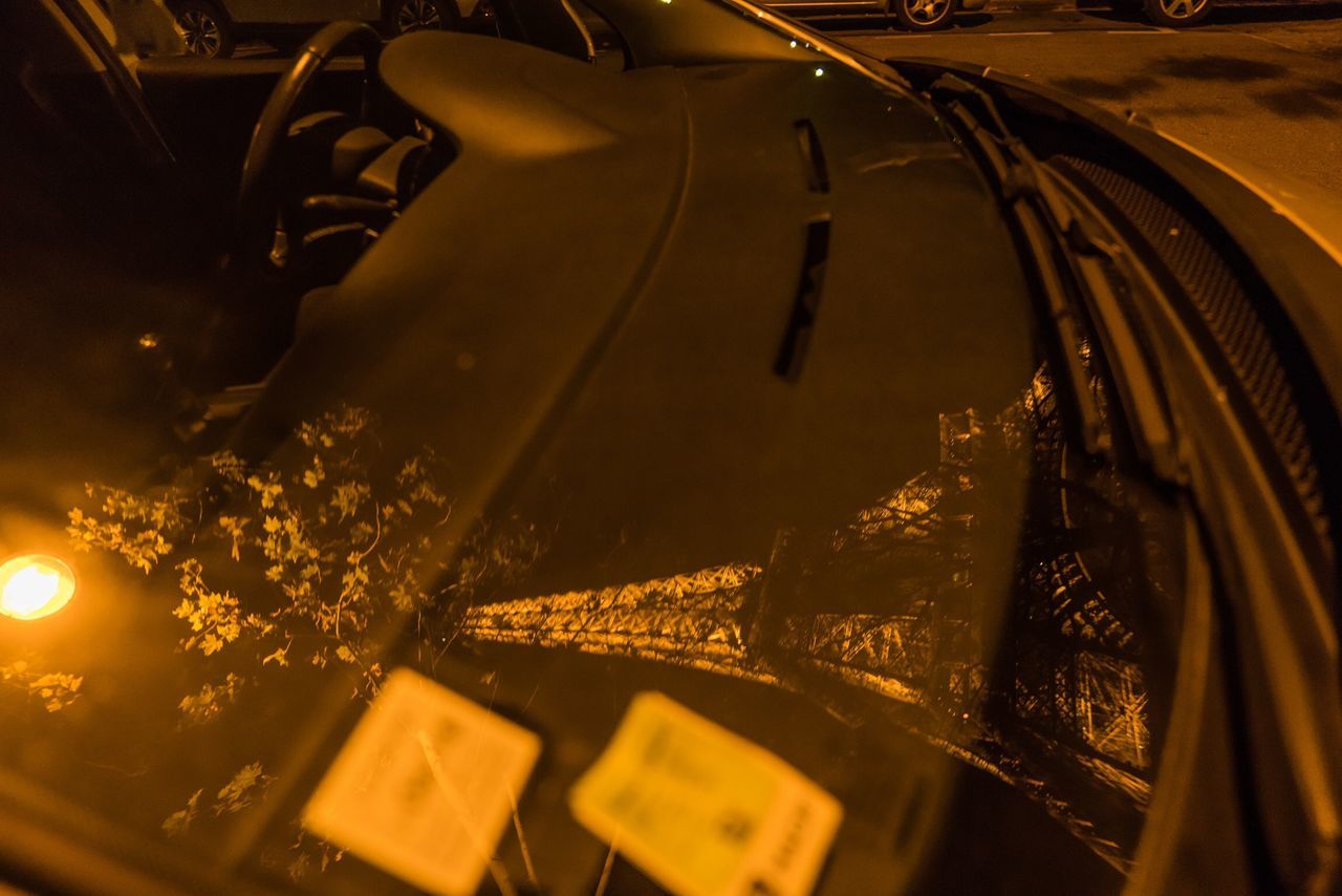 HIGH ANGLE VIEW OF CARS IN ILLUMINATED UNDERGROUND