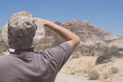 Rear view of man looking at mountain