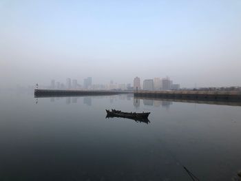 Reflection of cityscape in foggy weather