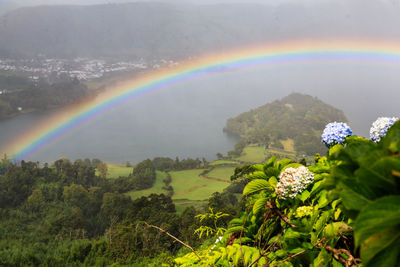 Scenic view of rainbow over mountain