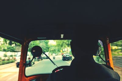 Man driving car on road