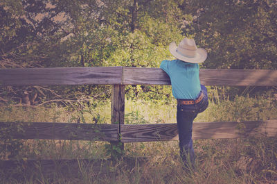 Rear view of woman standing in park