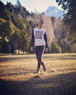 Portrait of smiling man standing on land