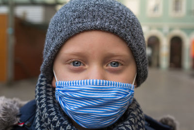 Portrait of teenage girl covered with snow