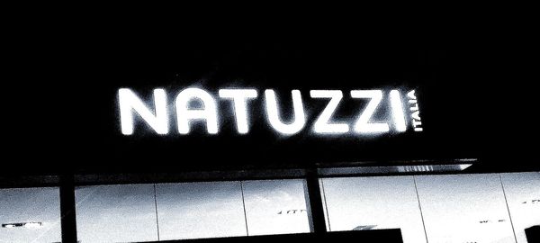 Low angle view of illuminated sign at night