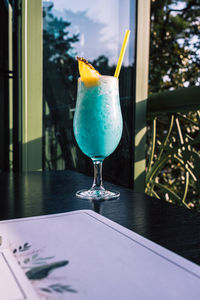 Tropical cocktails with pineapple and straw in glasses. pina colada. blue curacao. 