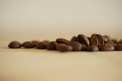 Close-up of coffee beans against white background