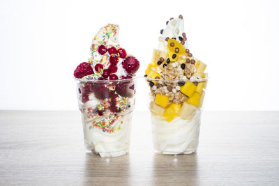 Close-up of dessert on table against white background