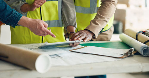 Midsection of man working at table