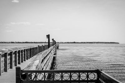 Pier over sea against sky