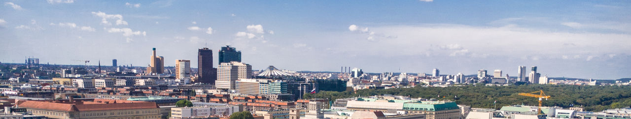 Panoramic shot of cityscape against sky