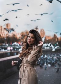 Portrait of beautiful young woman standing outdoors