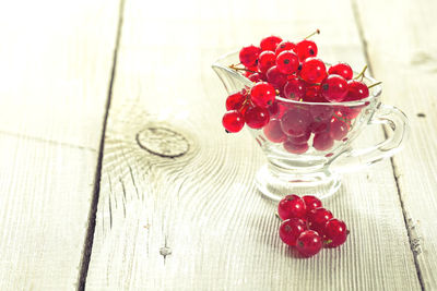 High angle view of red berries on table