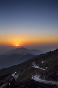 Scenic view of mountains against sky during sunset