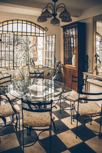 Empty chairs and tables in restaurant