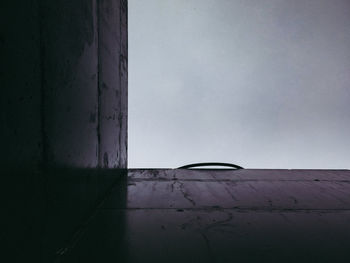 Close-up of wet car against sky during rainy season