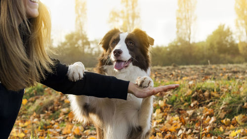 Woman with dog in forest