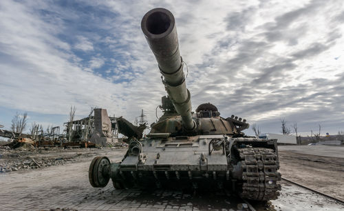 Low angle view of abandoned vehicle