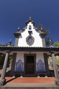 Low angle view of church against blue sky