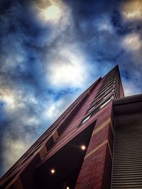 Low angle view of building against cloudy sky